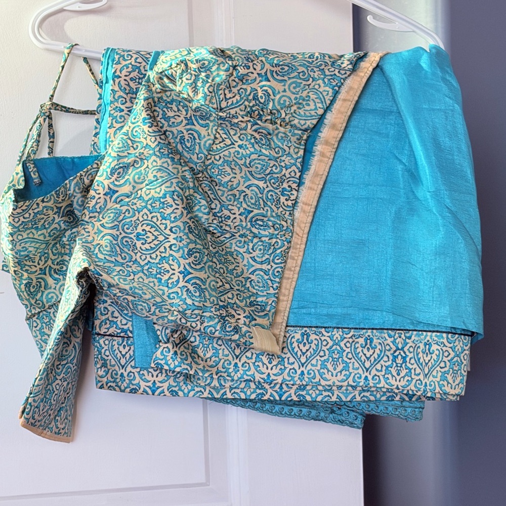 Elegant Blue and Gold Patterned Fabric Saree